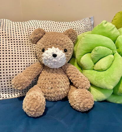 crocheted teddy bear with light brown yarn